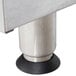 A close-up of the metal legs with rubber bases on an APW Wyott dual countertop range.