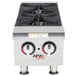 An APW Wyott countertop gas range with two burners.