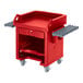 a red cart with a shelf