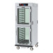 A Metro C5 9 Series pass-through heated holding and proofing cabinet with clear Dutch doors.