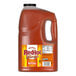 A 1-gallon jug of Frank's RedHot Original Buffalo Wing Hot Sauce.