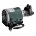 A green Micro Matic pump/motor assembly with a cord attached.