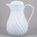 a white pitcher with a handle