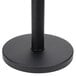 A black metal base with a black pole.