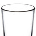 A close-up of a Libbey beverage glass with a black rim.