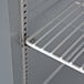 A white shelf in a Beverage-Air worktop freezer.