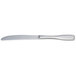 An Arcoroc stainless steel dinner knife with a white handle and silver blade.