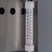 A Beverage-Air sandwich prep table with a thermometer on a metal surface.