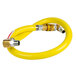 A yellow T&S gas connector hose with metal connectors.