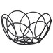 A black wire bread basket with rings on a table.