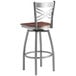 A Lancaster Table & Seating bar stool with a wooden seat and metal frame.