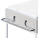 Chrome shelf brackets on a white marble counter top with silver handles.