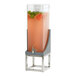 A Cal-Mil Ashwood Gray Oak wood beverage dispenser with an infusion chamber filled with water and fruit.