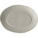 An American Metalcraft white oval melamine serving platter with a circular design in the middle.