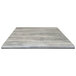 A close up of a grey square Holland Bar Stool table top.