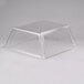 A clear plastic container with a clear top on a Star Grill Max hot dog roller grill.