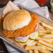 A tray with a chicken sandwich and fries.