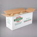 A case of Napoli rigatoni pasta on a gray surface.