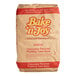 A brown Bake'n Joy Foods bag of chocolate pudding cake mix with red and yellow text.