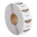 A roll of white Noble Products labels with brown writing on them.