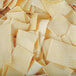 A pile of Little Barn Noodles squares on a white surface.