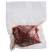 A plastic bag of Warrington Farm Meats frozen baseball cut sirloin steaks.