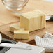 A block of Clover Dale butter on a cutting board.