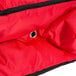 A red and black Rubbermaid insulated pizza delivery bag with a zipper.