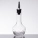 An American Metalcraft diamond glass bitters bottle with a metal top.