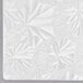 A white square Enjay cake drum with a pattern of leaves on the surface.