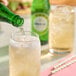 A person pouring Boylan Bottling Co. Ginger Ale into a glass.