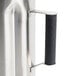 A Hamilton Beach stainless steel blender container with a handle.