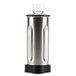 A Hamilton Beach stainless steel blender jar with a black lid.