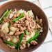 A bowl of rice, green beans, and ground turkey on a white background.