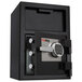 A black FireKing depository security safe with an electronic lock.