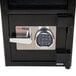 A black FireKing depository security safe with an electronic keypad.