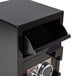 A black FireKing depository security safe with a key lock.