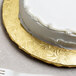 A white cake on a gold Enjay cake drum.