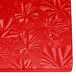 A red surface with a leaf pattern on it.