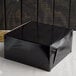 A black Enjay cake box on a table.