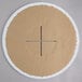 A circular cardboard with a cross.