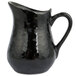 An American Metalcraft black porcelain bell creamer with a handle.