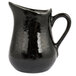 An American Metalcraft black porcelain bell creamer with a handle.