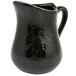 An American Metalcraft black porcelain bell creamer with a handle.