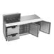 A stainless steel Beverage-Air sandwich prep table with open doors and drawers.