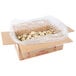 A white box of David's Cookies Gourmet Chocolate Chip Cookie Dough with plastic wrap on top.