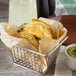 A basket of Don Miguel Mini Shredded Beef Tacos with guacamole.