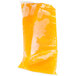 A plastic bag of yellow liquid.