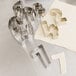 A set of Ateco stainless steel number cookie cutters on a white surface.