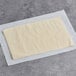 A Pennant French puff pastry dough sheet on white paper.